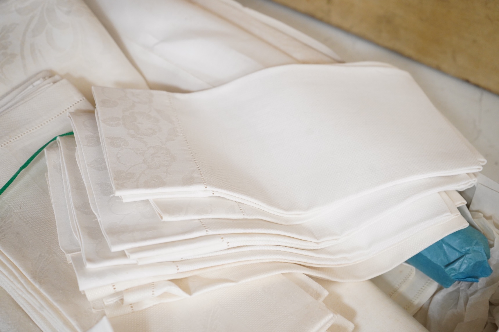 A collection of mixed damask embroidered and cutworked table cloths, napkin sets, hand towels and mats (in 3 boxes)